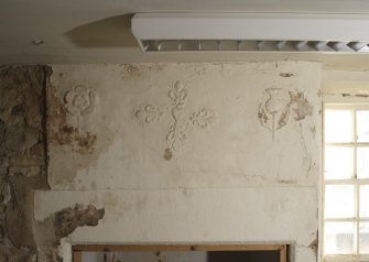 Interior, detail of plasterwork and fireplace lintel, first floor, room to front, SW house.