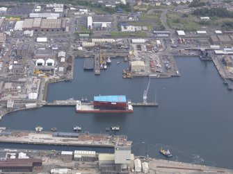 Oblique aerial view of Rosyth Dockyard, taken from the SSW.