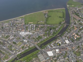 General oblique aerial view of Musselburgh centred on New Bridge, taken from the S.