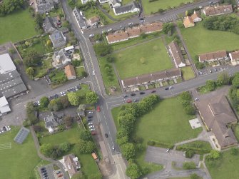 Oblique aerial view of Preston Market Cross, taken from the ENE.