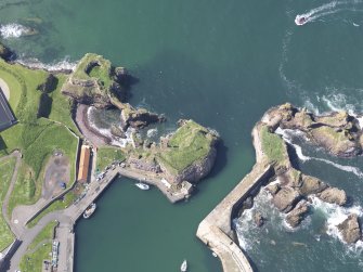 Oblique aerial view of Dunbar Castle, taken from the E.
