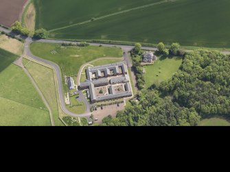Oblique aerial view of Thurston Home Farm, taken from the NW.