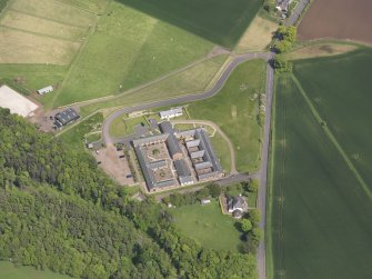 Oblique aerial view of Thurston Home Farm, taken from the SSW.