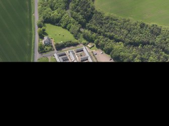 Oblique aerial view of Thurston Home Farm, taken from the NE.