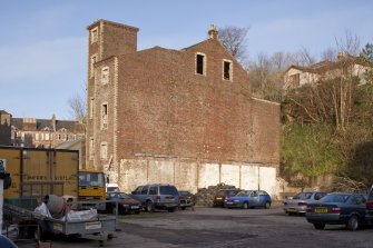 General view of derelict red brick former bakery at 6-8 East Princes Street, Rothesay, Bute, from W