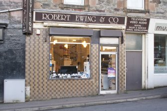 View of tiled shop front at 7, 9, 11 and 13 High Street, Rothesay, Bute, from NW
