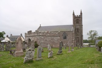 General view of graveyard and church from east.