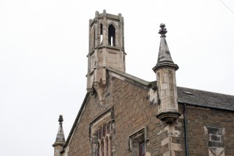 View of gablehead bell-cote and bartizans on south east elevation, taken from east.