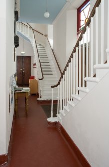 General view showing arrangement of balcony stairs within entrance hallway.