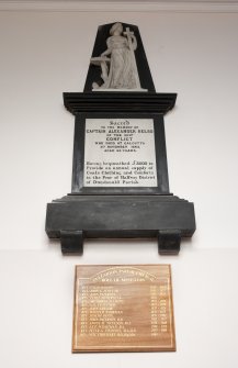 Detail of memorials on wall of entrance hall.