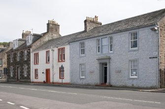 General view from NW showing terraced houses at 66, 67, 68 and 69 Marine Road, Port Bannatyne, Bute