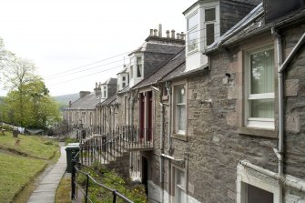 View of rear elevations from S showing 'Colonies style' entrances to 4-19 Victoria Place, Marine Road, Port Bannatyne, Bute