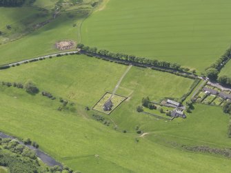 Oblique aerial view of Cranshaws Parish Church, taken from the NE.