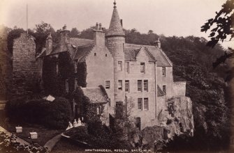 View of Hawthornden Castle from NW with four seated women outside.
Titled: 'Hawthornden, Roslin. 241. G W W'.
PHOTOGRAPH ALBUM NO 195: PHOTOGRAPHS BY G W WILSON & CO