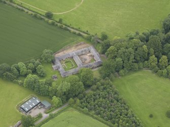 Oblique aerial view of Wedderburn Castle stable block, taken from the SSW.