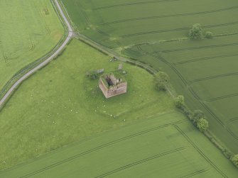 Oblique aerial view of Cessford Castle, taken from the SW.
