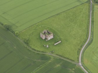 Oblique aerial view of Cessford Castle, taken from the NE.