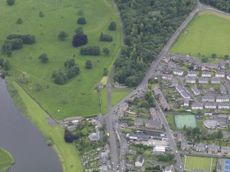 Oblique aerial view of Floors Castle gateway and lodges, taken from the SE.