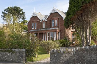 General view of red sandstone villa at 6 Shore Road, Port Bannatyne, Bute, from N