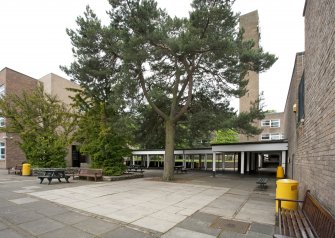 Paved area to Gilmore House and Clock Tower. View from NE.