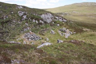 View of huts (c) and (d), taken from the SW.