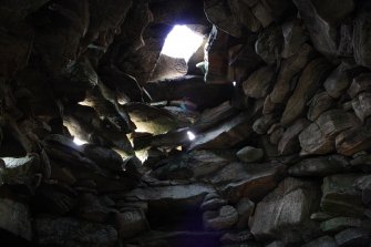 Interior of hut (d).