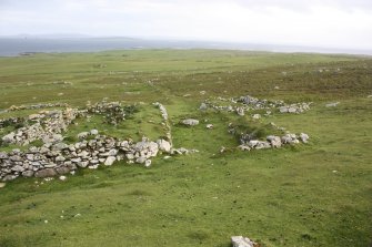 North Lingay. General view of one building superimposed on the remains of another at NF 89336 87835, taken from the NE.