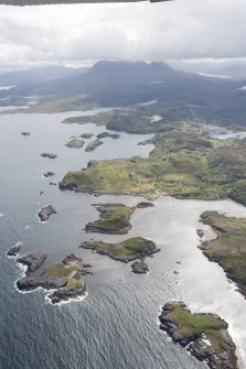 General oblique aerial view across Drumbeg towards Quinag, looking ESE.