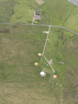 Oblique aerial view centred on Rysa Lodge and the remains of Rysa Battery, Hoy, looking E.