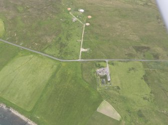 Oblique aerial view centred on Rysa Lodge and the remains of Rysa Battery, Hoy, looking WNW.