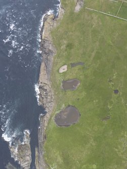 Oblique view of Muckle Skerry, centred on the mounds, looking to the ENE.