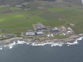 Oblique aerial view of Dounreay Nuclear Development Establishment, centred on the SW site, looking SE.