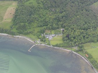 Oblique aerial view centred on Tongue House, looking SE.