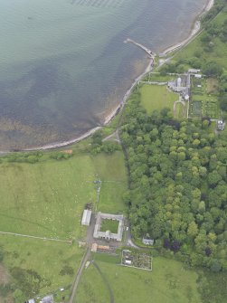 Oblique aerial view centred on Tongue House and Tongue Mains, looking NE.