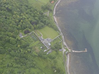 Oblique aerial view centred on Tongue House, looking SW.