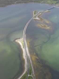 Oblique aerial view of the A836 causeway crossing the Kyle of Tonge, with the earlier causeway adjacent, looking W.