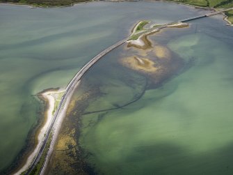 Oblique aerial view of the A836 causeway crossing the Kyle of Tonge, with the earlier causeway adjacent, looking WSW.