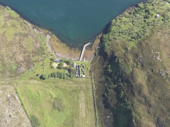 Oblique aerial view of the pier and buildings, Tanera Mor/Tannara Mor, looking E.