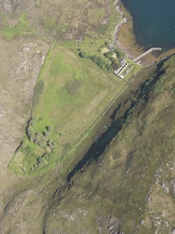 Oblique aerial view of the pier and buildings, Tanera Mor/Tannara Mor, looking ENE.