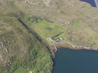 Oblique aerial view of the pier and buildings, Tanera Mor/Tannara Mor, looking W.