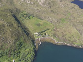 Oblique aerial view of the pier and buildings, Tanera Mor/Tannara Mor, looking W.