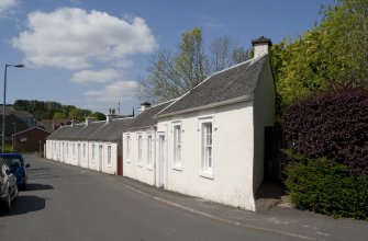 General view from SE showing whitewashed cotton workers' cottages at 1, 2, 3, 4 and 5 John Street, Rothesay, Bute
