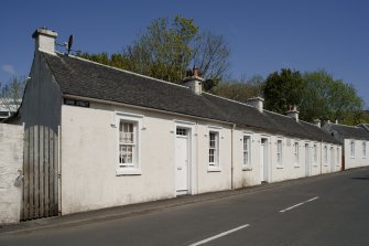 General view from W showing whitewashed cotton workers' cottages at 1, 2, 3, 4 and 5 John Street, Rothesay, Bute