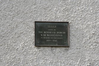 Detail of plaque reading 'S.V.G.C.A Given by The Rothesay Burgh War Relief Fund in memory of the fallen 1939-1945' at 1-5 Sheriff's Croft, Barone Road, Rothesay, Bute