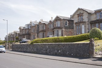 General view from NW showing semi-detached and terraced houses comprising Elysium Terrace at 33-44 Mount Stuart Road, Craigmore, Rothesay, Bute