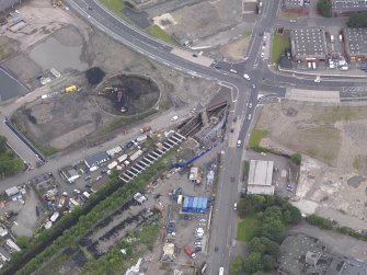 Oblique aerial view of Dalmarnock Station during construction works, taken from the SE.