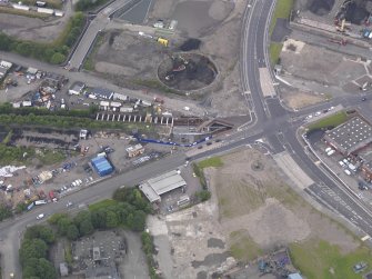 Oblique aerial view of Dalmarnock Station during construction works, taken from the E.