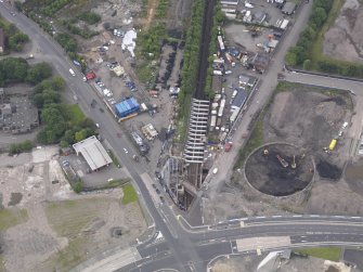 Oblique aerial view of Dalmarnock Station during construction works, taken from the NNW.