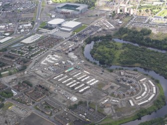 Oblique aerial view of the Glasgow Commonwealth Games Site during construction works, taken from the SSW.
.