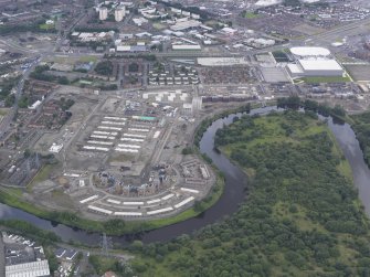 Oblique aerial view of the Glasgow Commonwealth Games Site during construction works, taken from the SE.